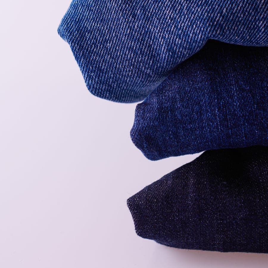 Close-up of blue denim jeans with buttons