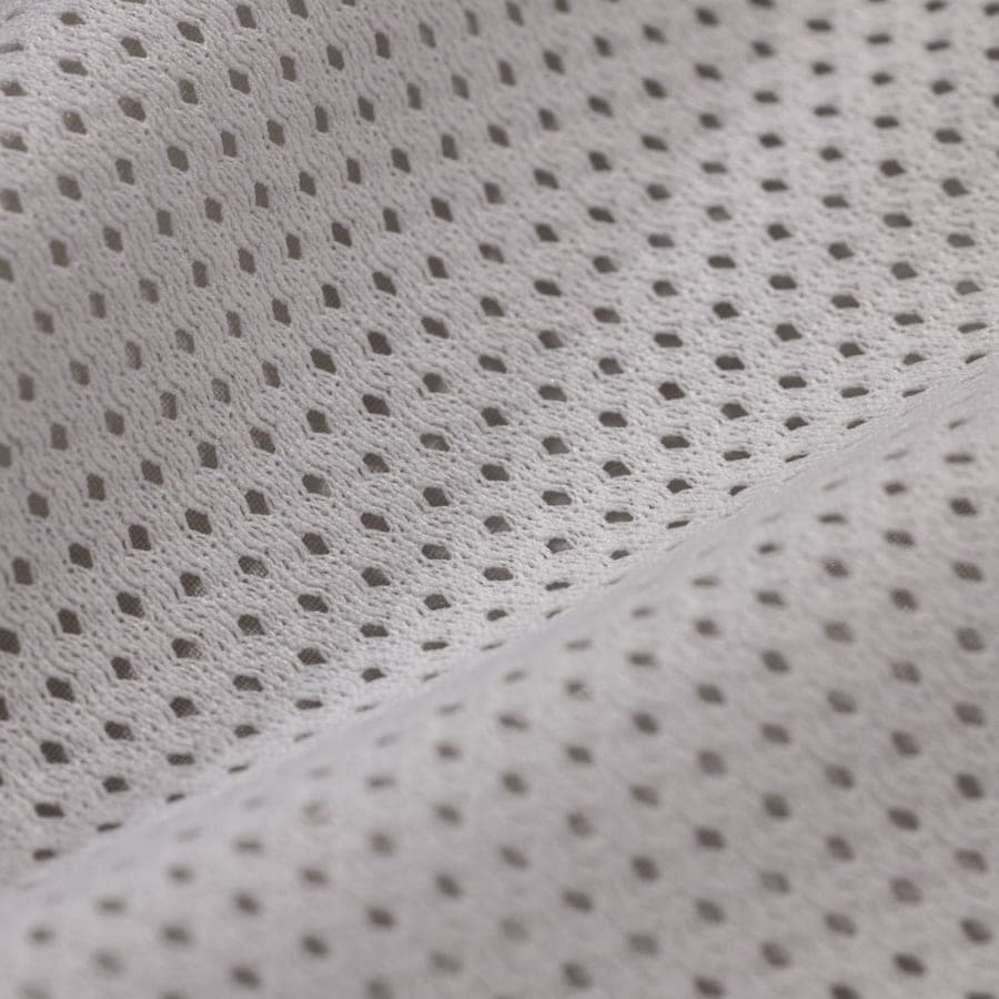 Close-up of white performance mesh fabric