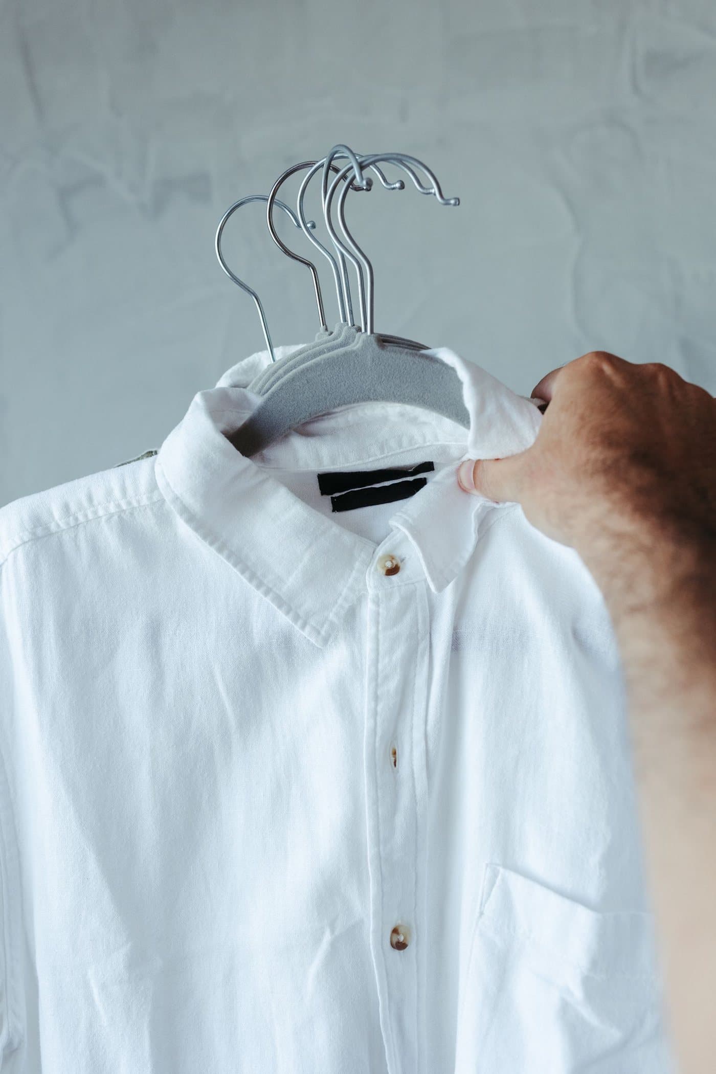 White button-down shirt on a hanger